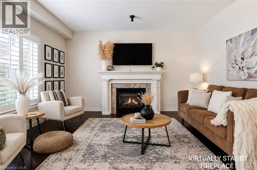 Bright Living Room w/ Fireplace - 53 Valiant Circle, Binbrook, ON