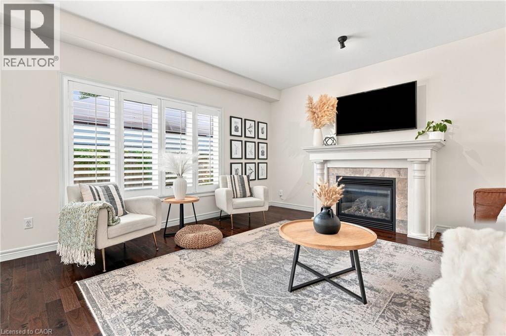 Bright Living Room w/ Fireplace - 53 Valiant Circle, Binbrook, ON
