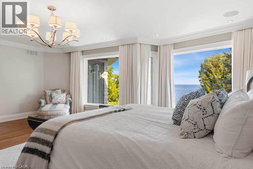 Hardwood flooring, crown molding, recessed lighting, and a crystal chandelier - 4038 Lakeshore Road, Burlington, ON
