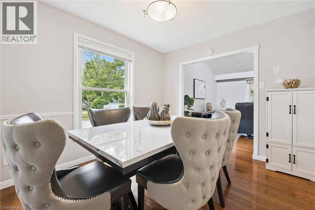 Hardwood flooring, painted trim, and a built-in storage cabinet - 21 Colebrook Court, Kitchener, ON
