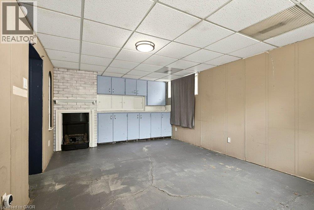Integrated cabinetry with light-toned doors - 27 Gretna Court, Hamilton, ON