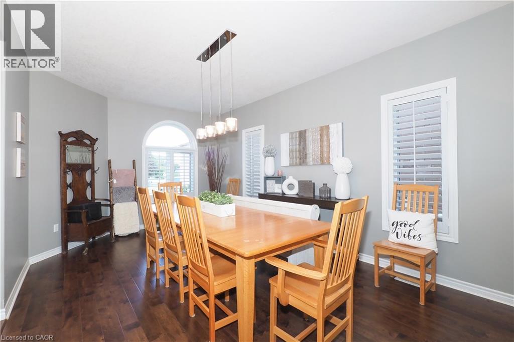Dark wood-finish flooring with light gray walls - 1200 Dunbar Road, Cambridge, ON
