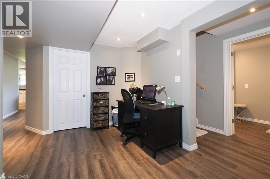 Recessed lighting, wood-finish flooring, white paneled door, and neutral wall color - 1200 Dunbar Road, Cambridge, ON
