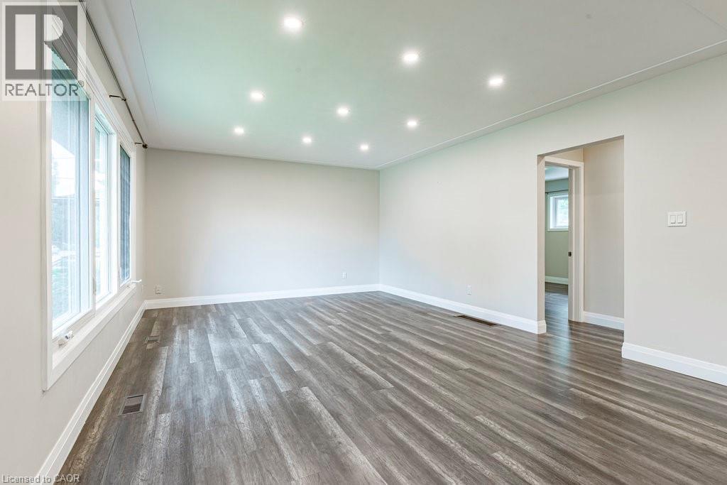 living room before current tenants - 173 West 32Nd Street, Hamilton, ON