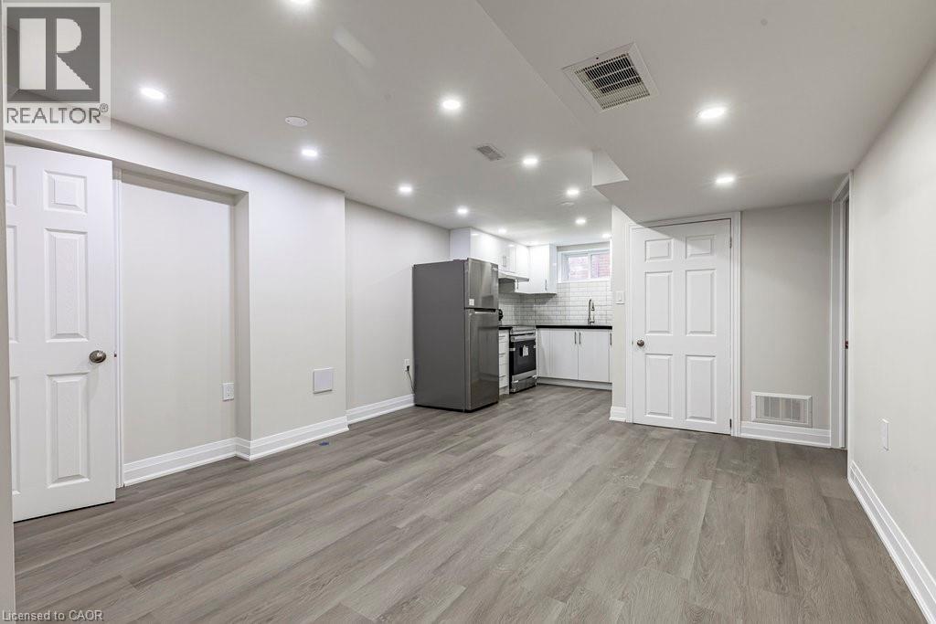 living room and kitchen in lower level - 173 West 32Nd Street, Hamilton, ON