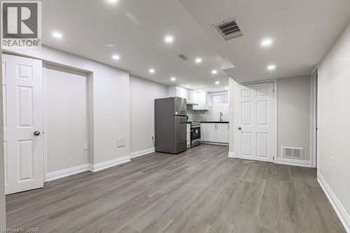 living room and kitchen in lower level - 173 West 32Nd Street, Hamilton, ON 