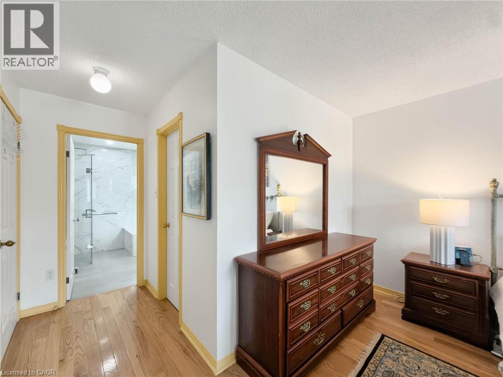 Hardwood flooring, white walls, and bright trim throughout - 1236 Thorpe Road, Burlington, ON