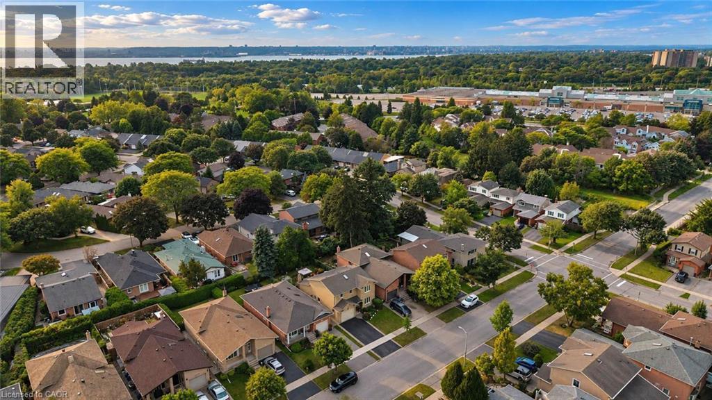 Residential neighborhood featuring mature trees, paved streets, and a distant body of water - 1236 Thorpe Road, Burlington, ON