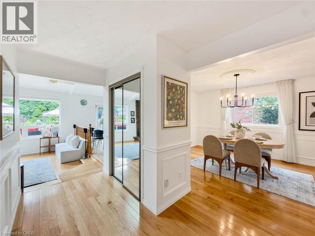 Hardwood flooring, mirrored closet doors, and wainscoting details - 1236 Thorpe Road, Burlington, ON