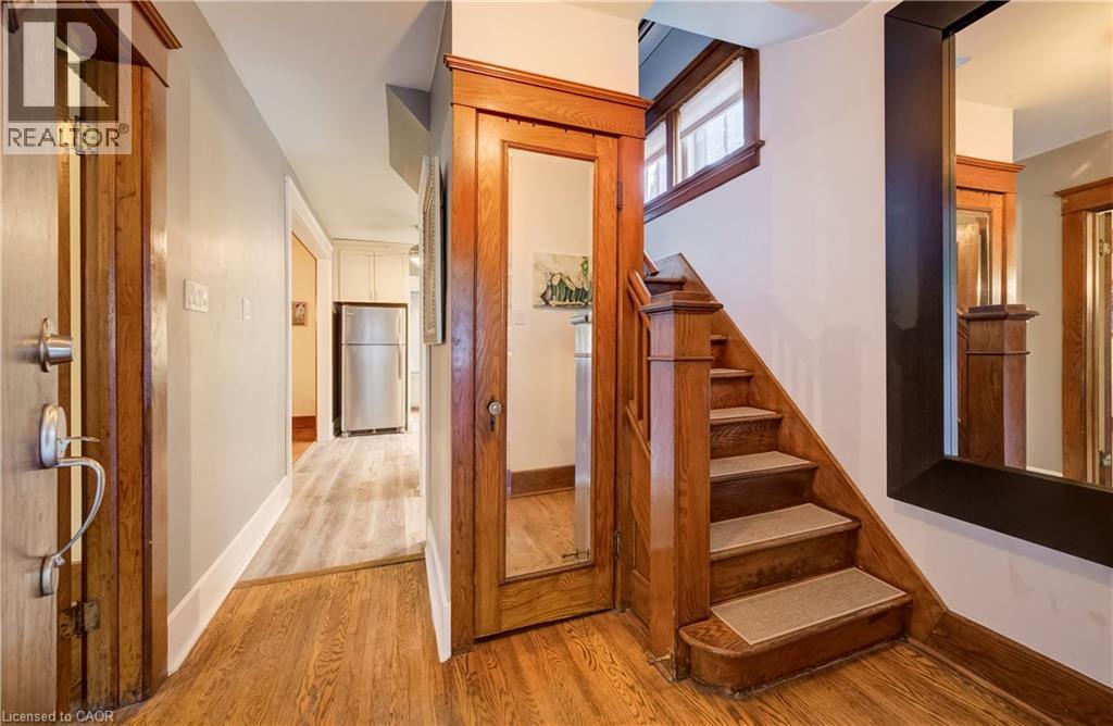 Wood-finish flooring throughout the entryway - 90 Brock Street, Kitchener, ON