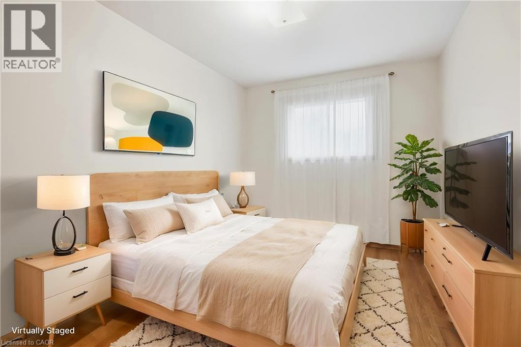 Recessed ceiling light, wood-finish flooring, and white walls - 137 Picton Street E, Hamilton, ON