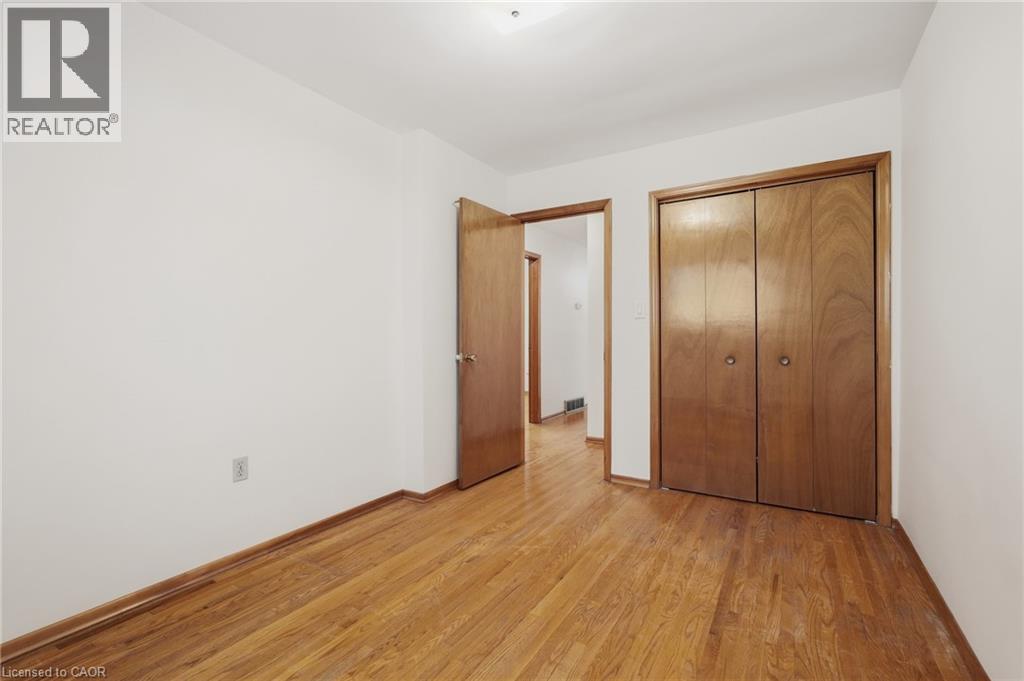 Wood-finish flooring with light-toned walls - 137 Picton Street E, Hamilton, ON