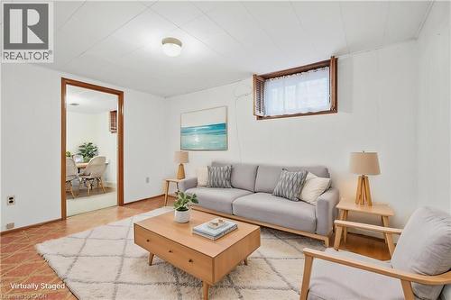 White walls, recessed window with wood shutters, and a wood-trimmed doorway - 137 Picton Street E, Hamilton, ON 