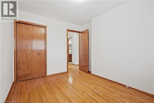 Wood-finish flooring, white wall paint, and wood-finish doors - 137 Picton Street E, Hamilton, ON 