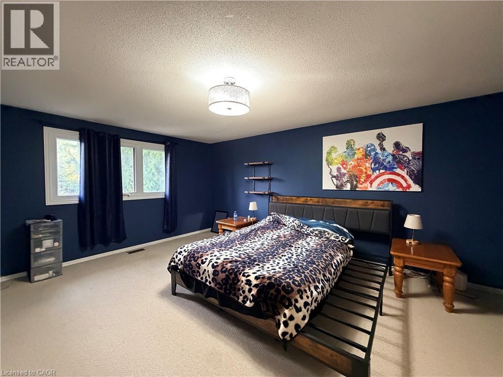 Recessed lighting, light-colored carpeting, and a built-in wall shelf - 450 Bridge Street W, Waterloo, ON