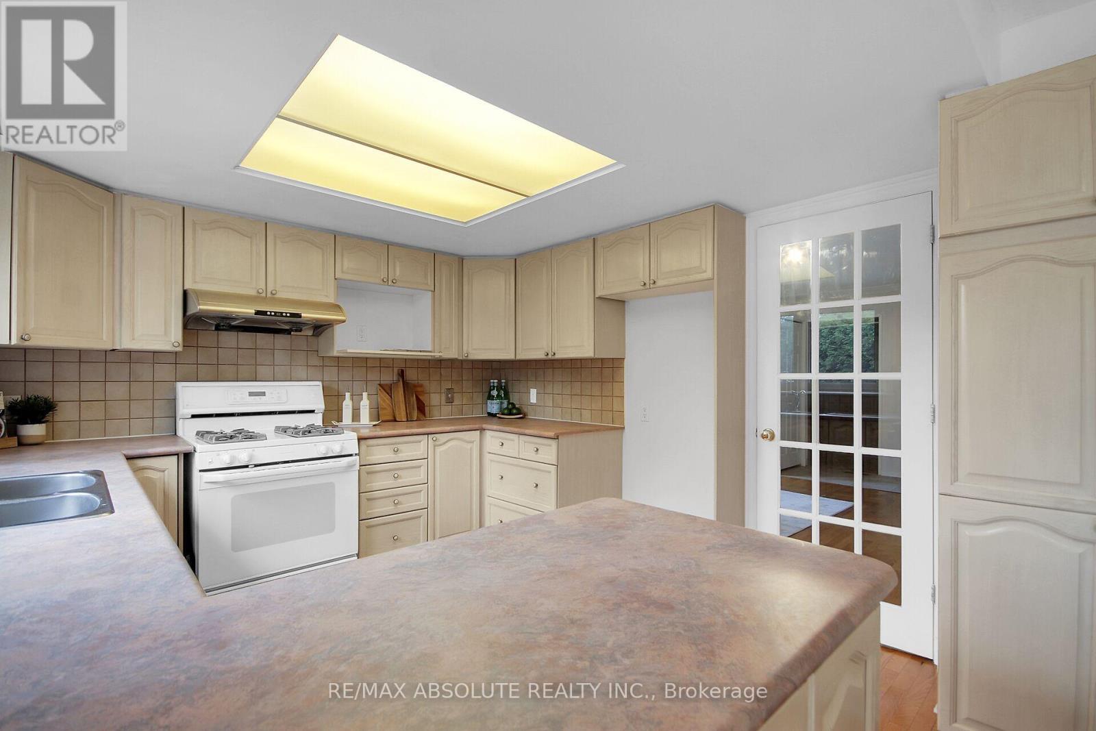 Kitchen w French Door to Main Floor Bedroom /Den - 38 Forestglade Crescent, Ottawa, ON