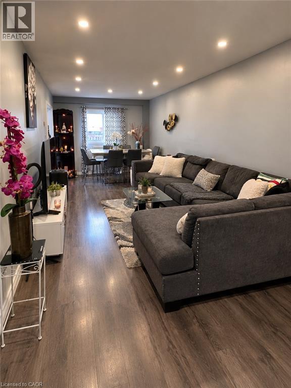 Recessed ceiling lighting, wood-finish flooring, and a dining area with window - 125 Fairgreen Close, Cambridge, ON
