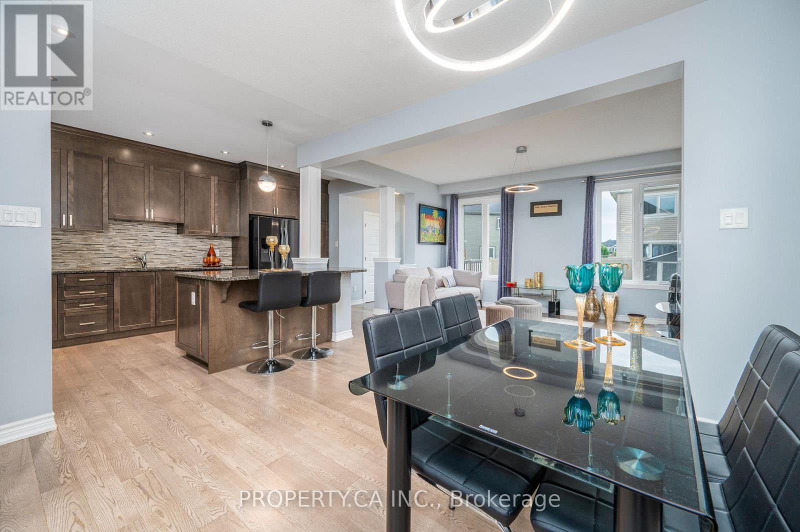 Open-concept kitchen & dining - 125 Sweetvalley Drive, Ottawa, ON