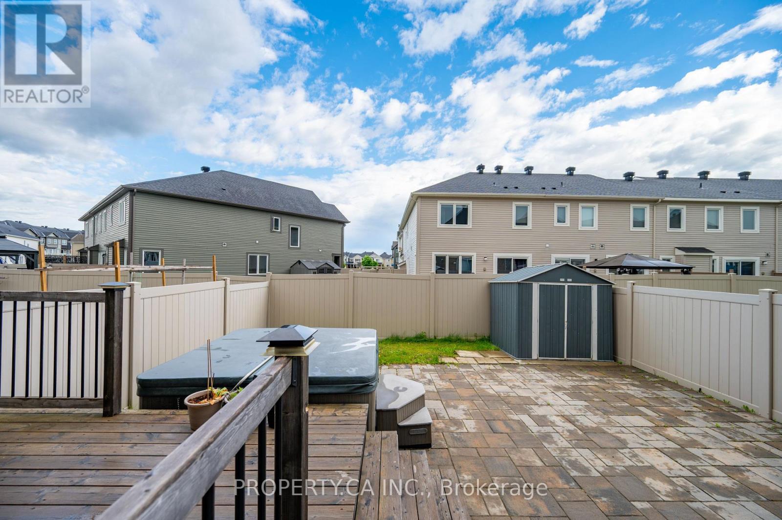 Backyard oasis with hot tub - 125 Sweetvalley Drive, Ottawa, ON