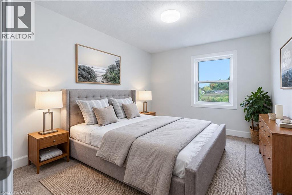 Carpeted room with a single window, white walls, and a flush-mount ceiling light - 30 S Imperial Road Unit# 3, Guelph, ON