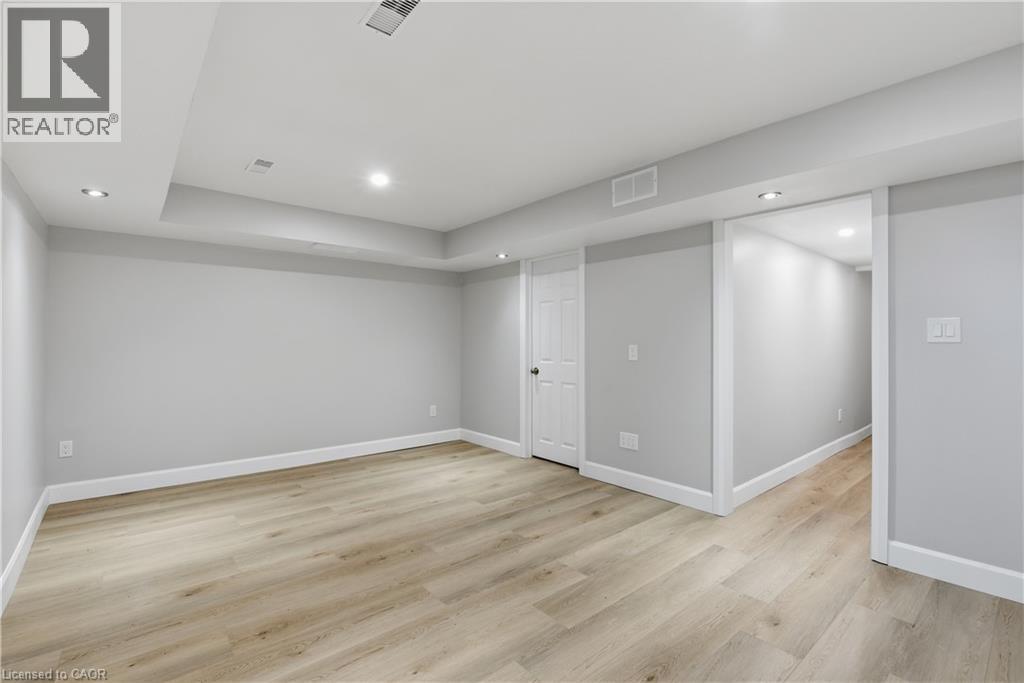 Recessed lighting, light wood-finish flooring, white trim, and a white interior door - 30 S Imperial Road Unit# 3, Guelph, ON