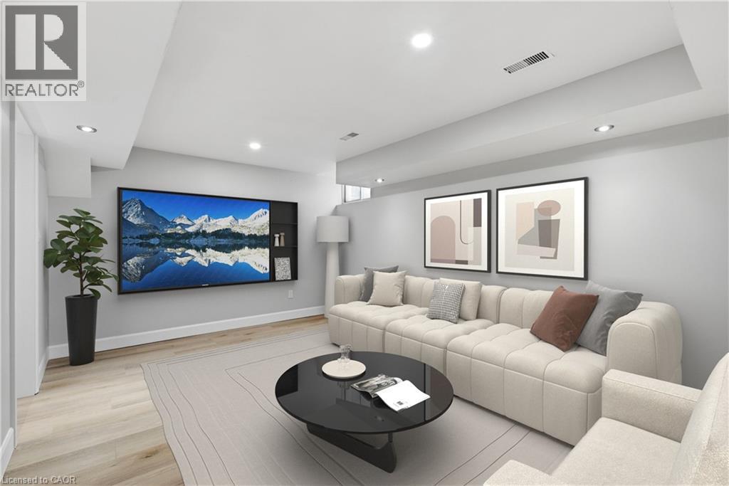Recessed lighting, light wood-finish flooring, built-in shelving, and light gray wall paint - 30 S Imperial Road Unit# 3, Guelph, ON