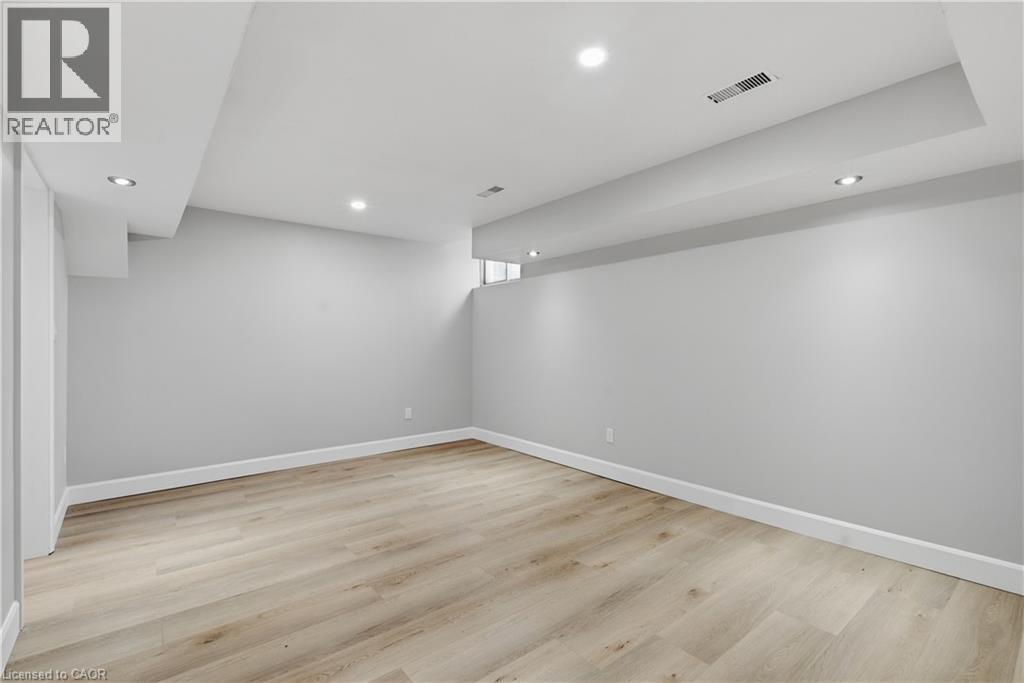 Recessed ceiling lights, light wood-finish flooring, white baseboards, and neutral wall paint - 30 S Imperial Road Unit# 3, Guelph, ON