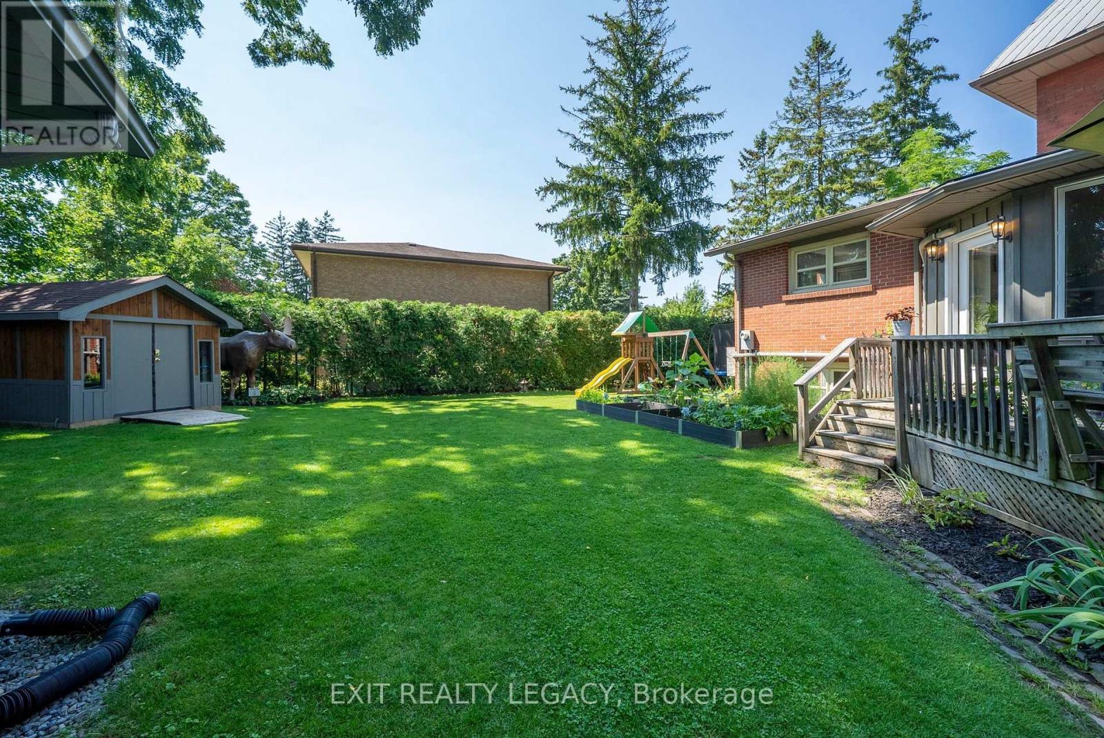 Private backyard with garden and restored shed - 126 Temperance Street, Aurora, ON