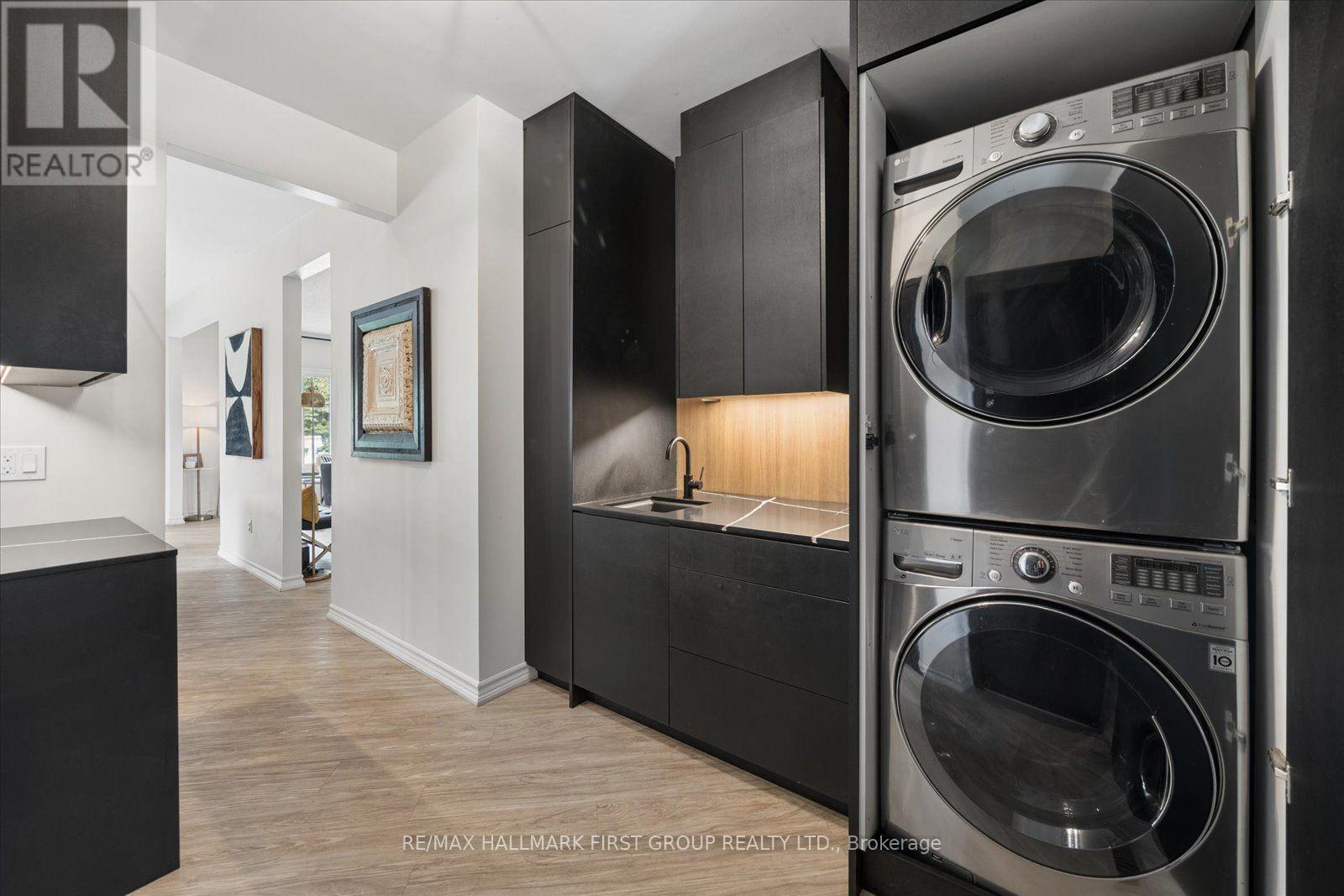 Mud Room / Laundry Area w/ Cabinetry Open - 33 Deerfield Drive, Hamilton Township, ON