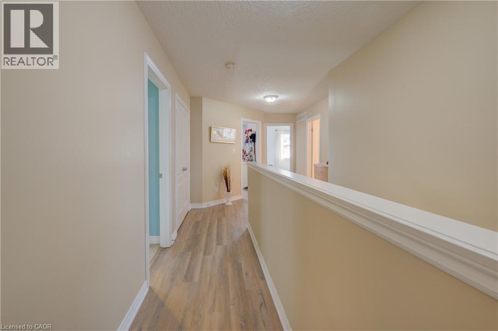 Laundry area with tiled flooring, a utility sink, and a single window - 78 Stuckey Avenue, Baden, ON
