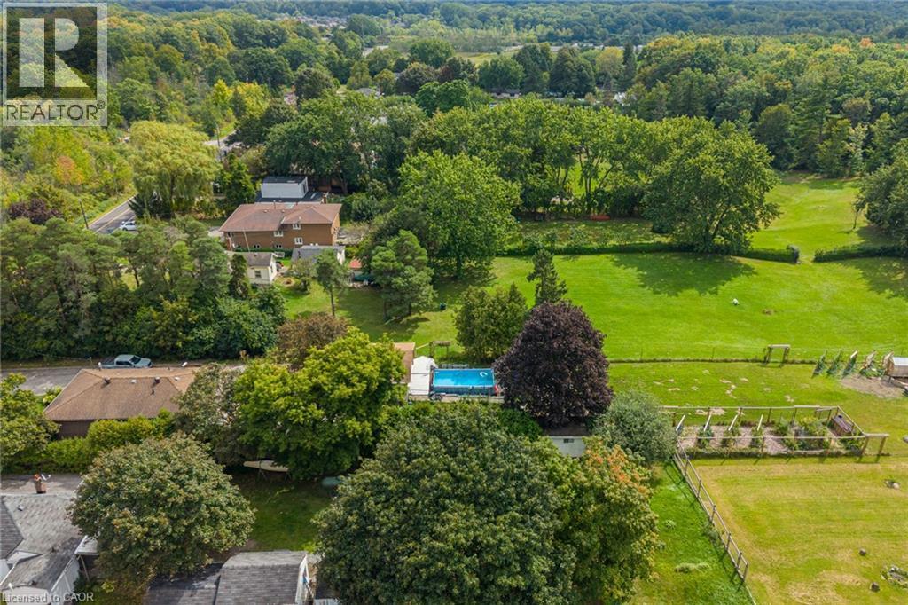 Expansive property featuring a swimming pool, a terraced garden area, and extensive green space - 1412 Old York Road, Burlington, ON