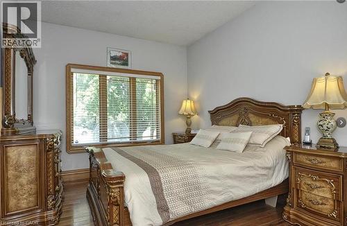 Wood-finish flooring with a light-toned ceiling and walls - 915 Briardean Road, Cambridge, ON 