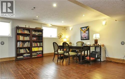 Recessed ceiling lighting, wood-finish flooring, two windows, wall sconces, and crown molding - 915 Briardean Road, Cambridge, ON 