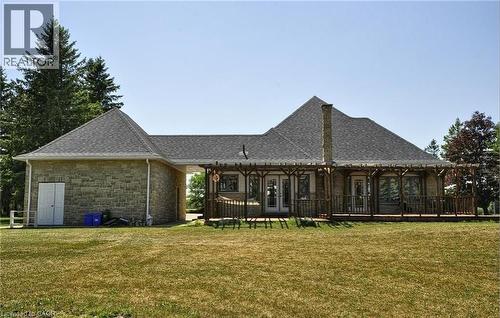 Stone exterior with a shingled roof - 915 Briardean Road, Cambridge, ON 
