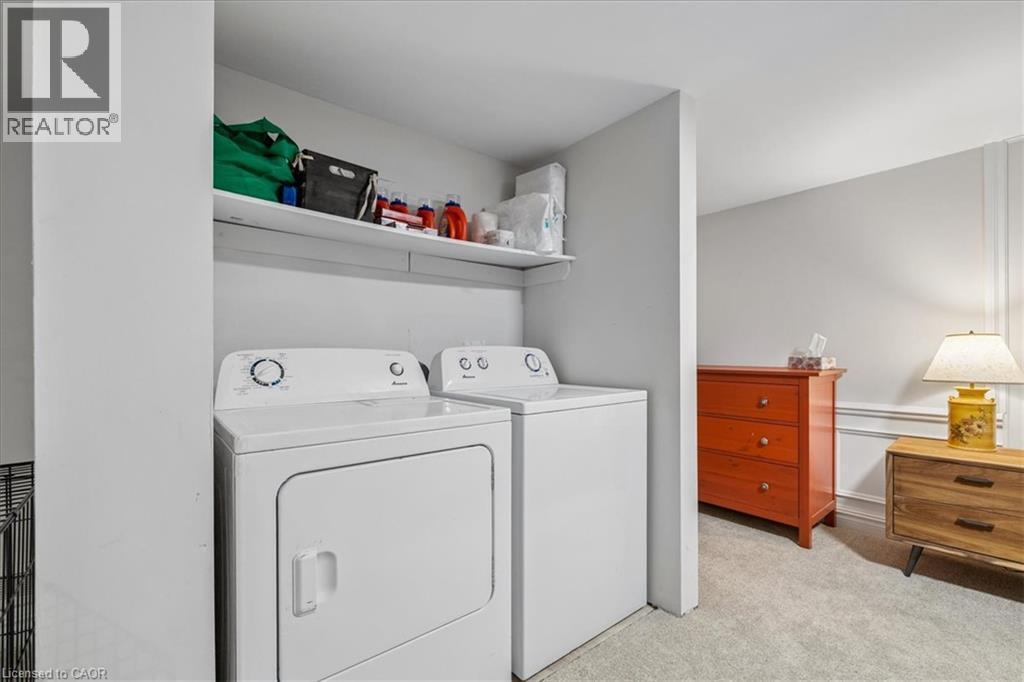Dedicated laundry area featuring a white dryer and washer - 80 Maclennan Avenue, Hamilton, ON