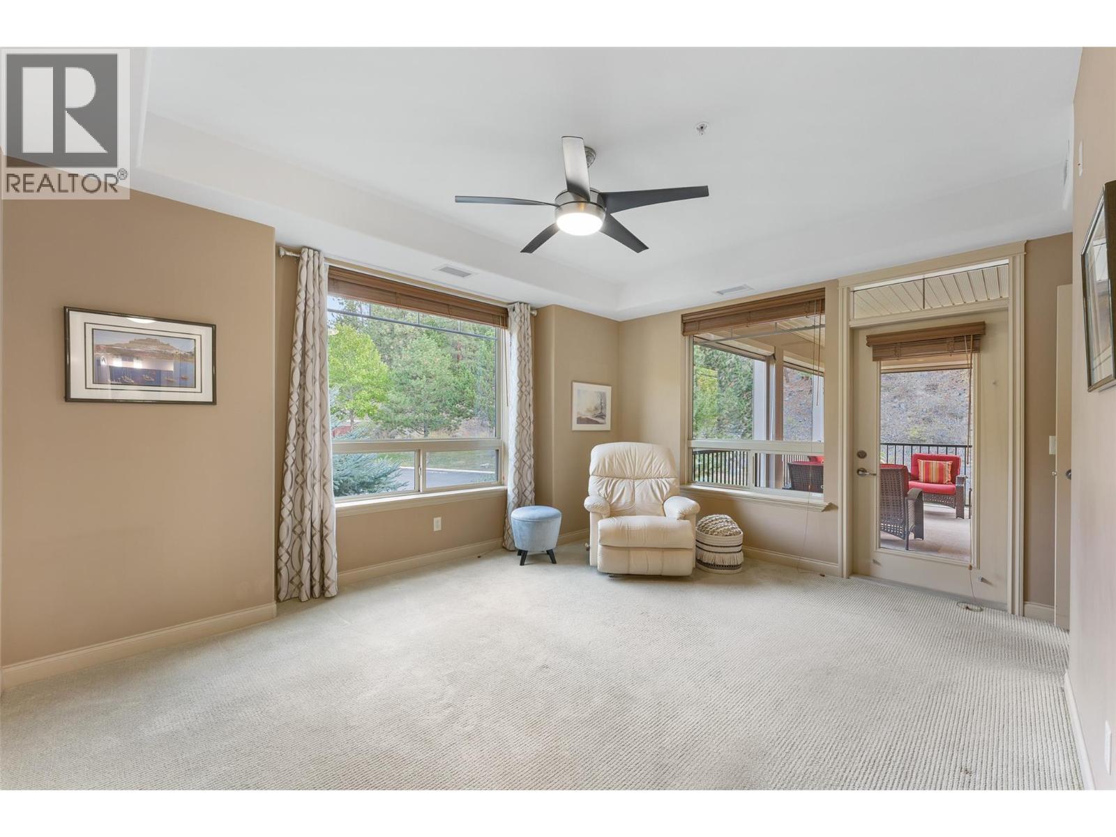 Large king-sized primary bedroom with direct access to the deck. - 2780 Auburn Road Unit# 203, West Kelowna, BC
