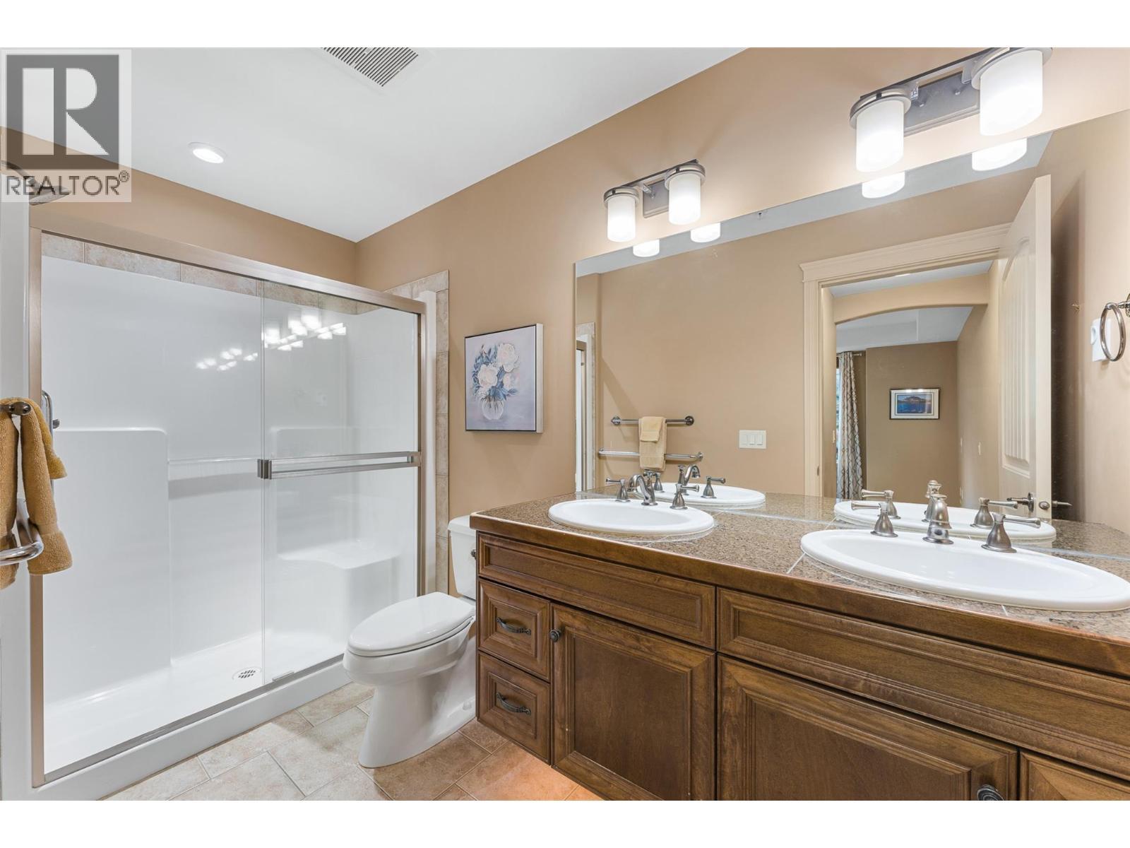 Luxurious ensuite with heated floors, double sinks and sensor vanity lighting. - 2780 Auburn Road Unit# 203, West Kelowna, BC