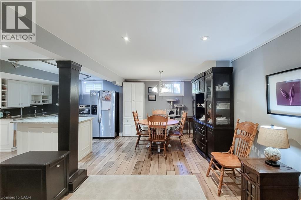 Wood-finish flooring throughout, recessed ceiling lights, and painted walls - 19 Thorndale Avenue, St. Catharines, ON