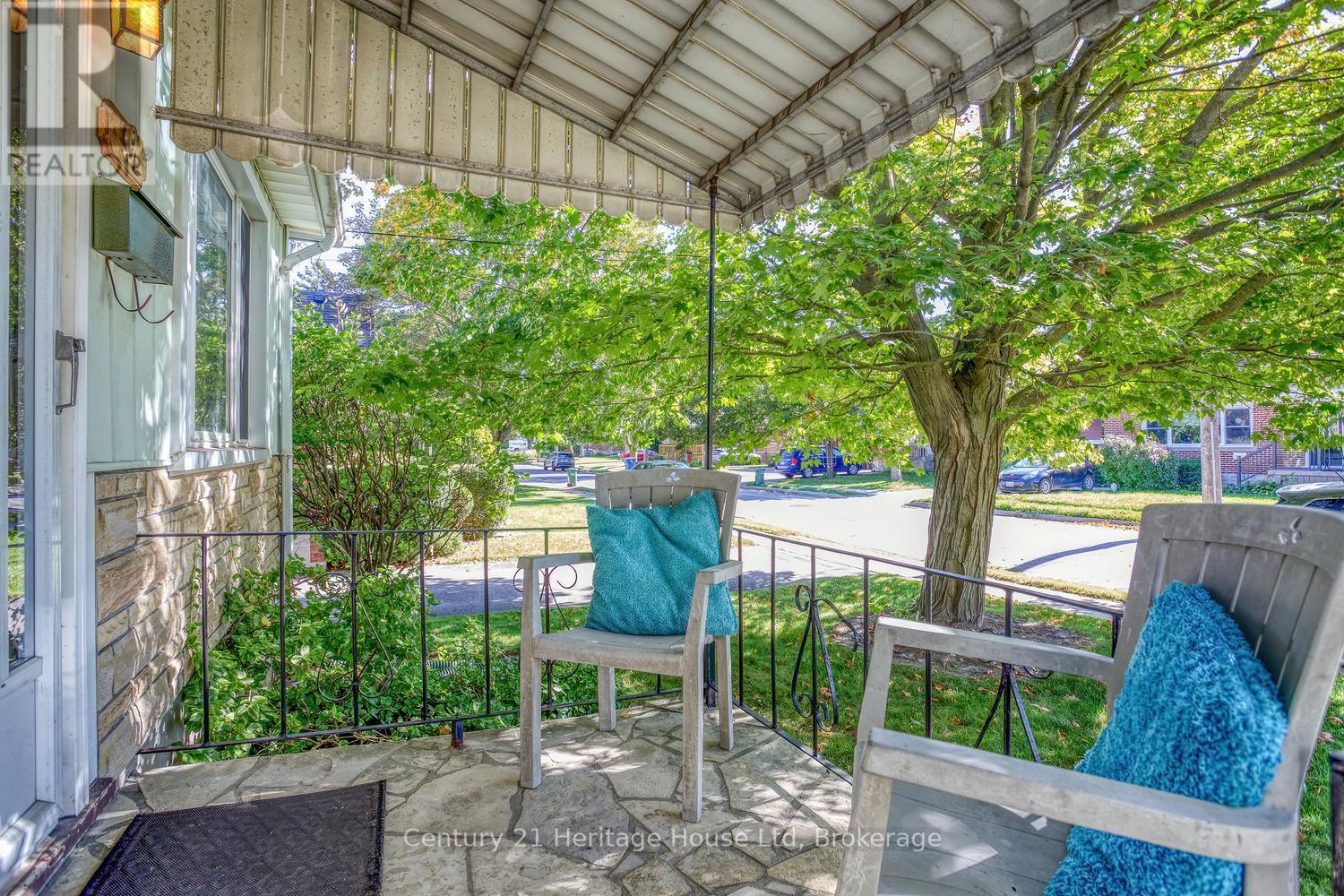 Front porch, railing and space for sitting - 91 Merion Street, Guelph (Junction/Onward Willow), ON