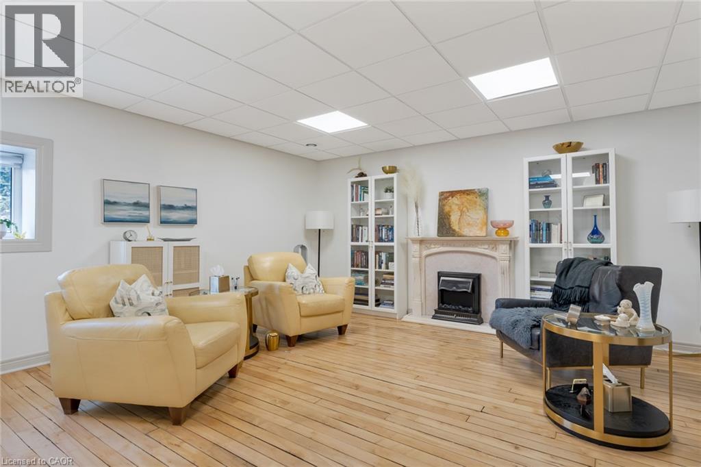 Hardwood flooring, recessed lighting, and a window with white trim - 23 Market Street W, Port Dover, ON