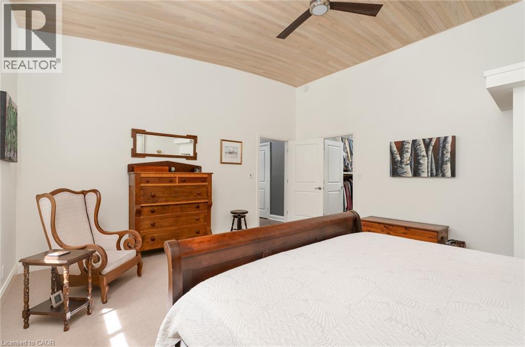 Vaulted wood-finish ceiling with a ceiling fan - 23 Market Street W, Port Dover, ON