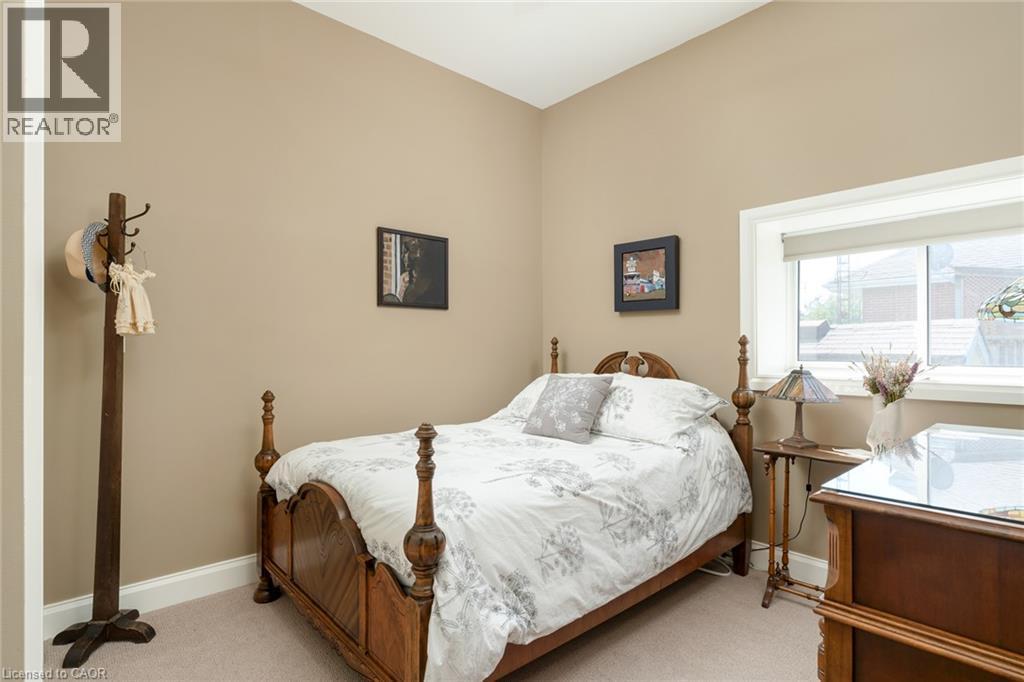 Neutral-toned walls complement plush carpeting - 23 Market Street W, Port Dover, ON