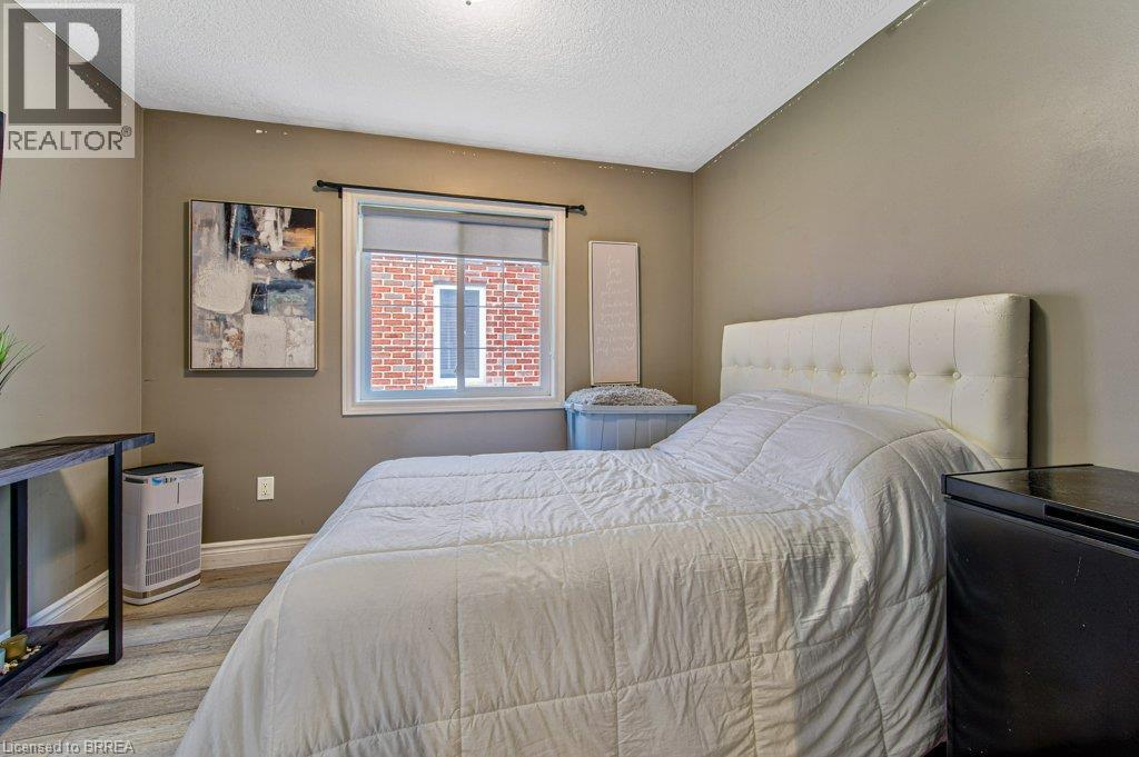 Wood-finish flooring with neutral wall tones - 423 Poldon Drive, Norwich, ON