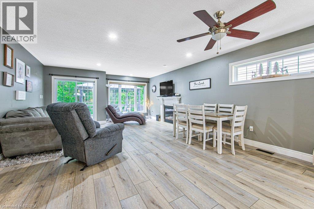 Wood-finish flooring, recessed lighting, and a ceiling fan with integrated light - 423 Poldon Drive, Norwich, ON