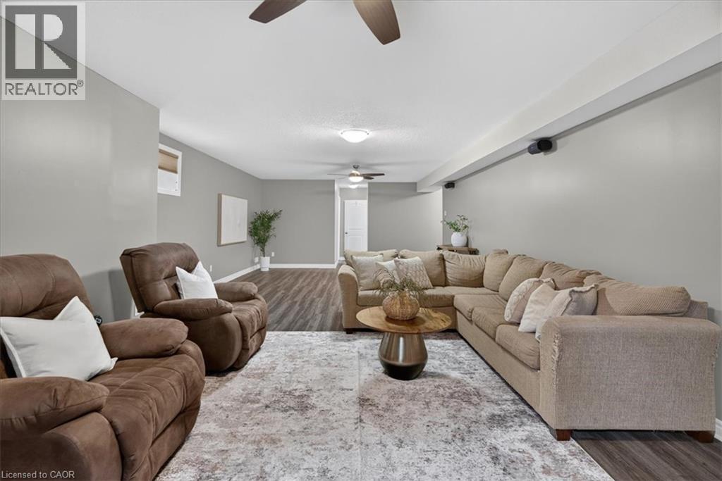 Wood-finish flooring throughout, complemented by light gray wall tones - 515 Woodward Drive, Mount Brydges, ON