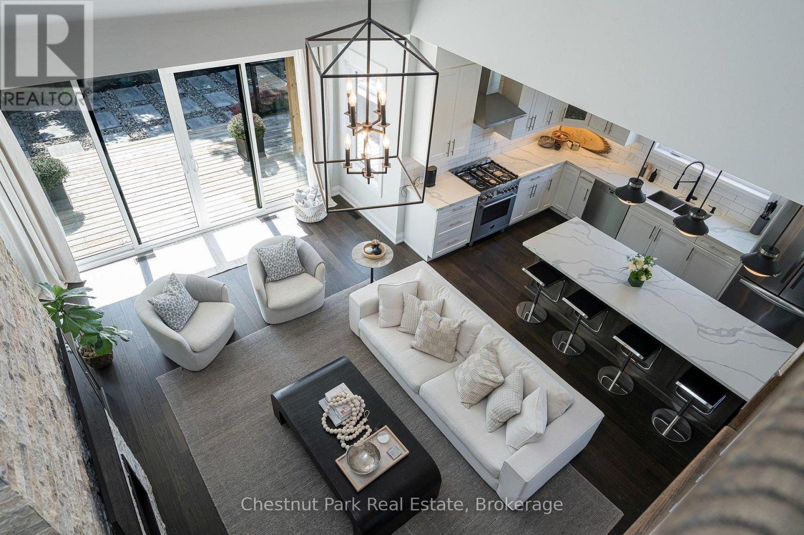 View from second floor to great room and kitchen - 154 Brooker Boulevard, Blue Mountains, ON