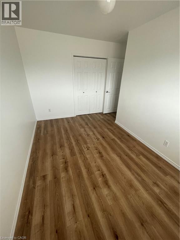 Main bedroom with wood-type flooring - 124 Avalon Place, Kitchener, ON