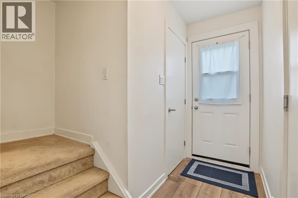 Wood-finish flooring at entry - 1444 Upper Ottawa Street Unit# 32, Hamilton, ON