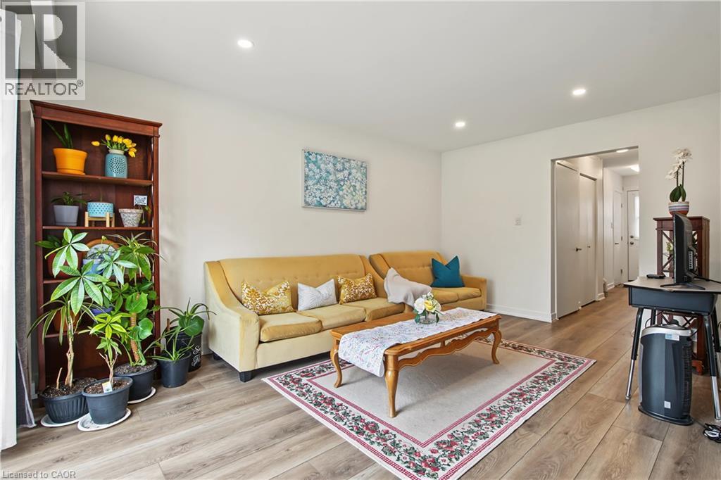 Recessed lighting illuminates wood-finish flooring - 1444 Upper Ottawa Street Unit# 32, Hamilton, ON