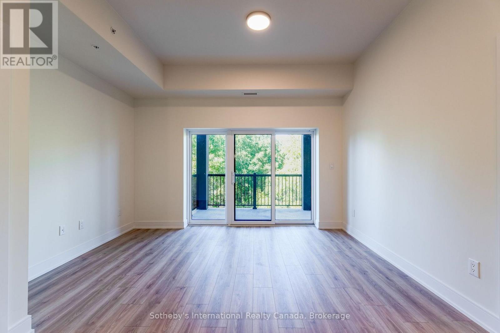 Spacious living room with sliding doors to Balcony - 316 - 121 Mary Street, Clearview (Creemore), ON